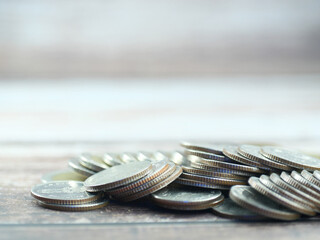 Stack of coins on blurred background in finance and savings concept.