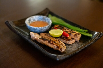 Japanese grilled salted salmon belly served on plate