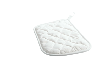 Isolated white quilted pot holder with a hanging loop on black