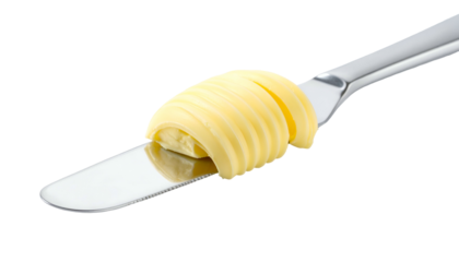 Rolled butter curl sitting on shiny silver butter knife