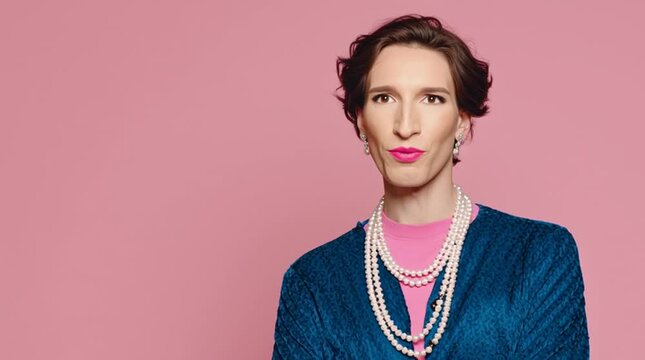 Elegant, gorgeous and proud young transwoman with vivid pink lipstick. Gender transition of an elegant transwoman