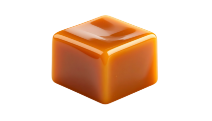 Shiny, amber-colored, cube-shaped candy with a dimple on top, isolated on black