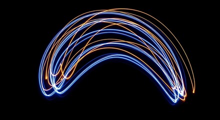Abstract blue and orange light trails forming a graceful arch on a black background.