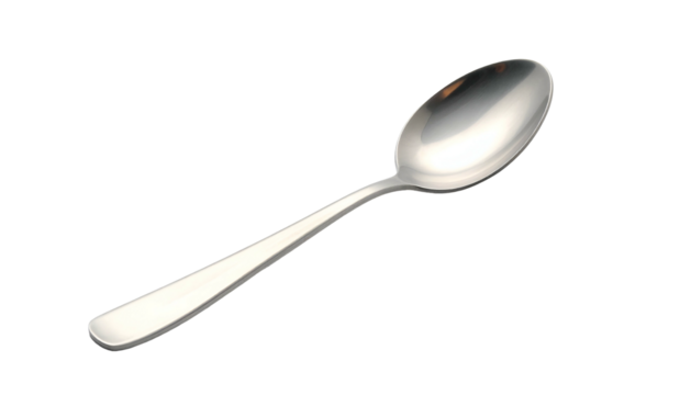 Polished silver spoon lying on dark background with soft lighting