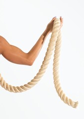 Person holding thick beige rope for workout on bright white background