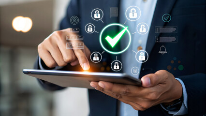 Man using tablet with security checkmark, ensuring data protection online