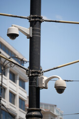 Obraz premium Security cameras monitoring busy urban street environment