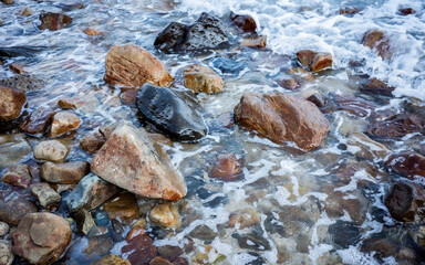 Wet Stones in Surf Zone with Clear Water