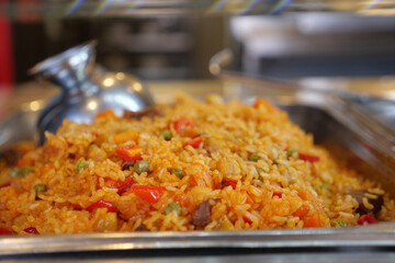 Colorful rice dish with vegetables served in a tray