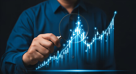 Financial graph analysis with magnifying glass and upward trend