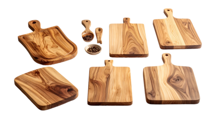 Wooden cutting boards, wooden spoons, peppercorns on black