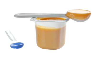 Baby food small container with a spoonful of pur?e