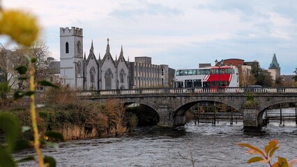 Obraz premium Beautiful Galway City River Corrib Bridge View with Historic Cathedral and Church Architecture, Ireland Travel Destination, European Tourism Landmark