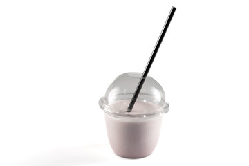 smoothie in plastic cup vanilla milkshake in a clear plastic cup with a lid and straw isolated on a white background