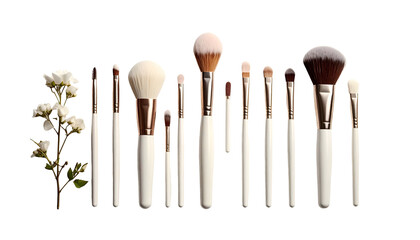 Assortment of makeup brushes alongside white flowers on dark backdrop
