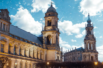 Naklejka premium Historic european architecture with tall spires under a cloudy sky