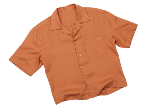 Isolated folded orange button-down shirt with chest pocket for tropical vacation attire