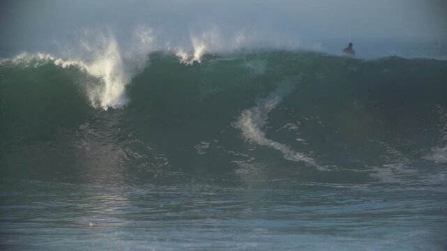 Slow motion breaking swell waves at the wedge