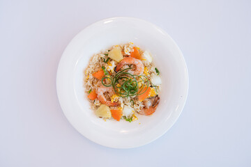 Delicious Shrimp and Pineapple Fried Rice on a White Plate