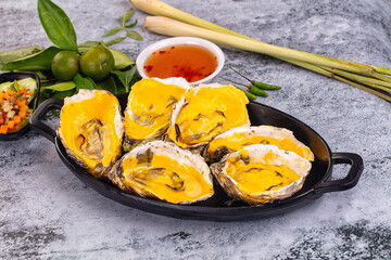 Baked oyster with cheddar cheese