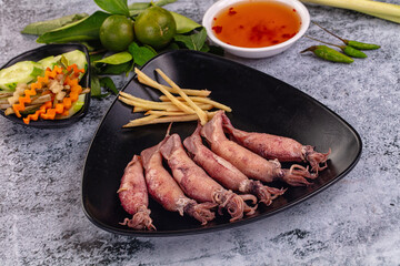 Boiled wild mini calamari snack