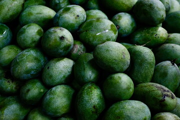 Close-up of Green Mangoes at a Local Fruit Market in Indonesia 