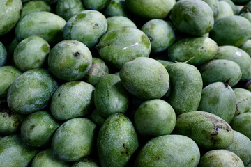 Close-up of Green Mangoes at a Local Fruit Market in Indonesia 