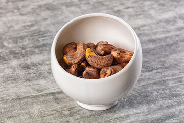 Unpeeled cashew nuts in the bowl