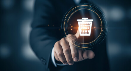 A businessman's finger points towards a digital trash can icon, symbolizing deletion, removal, or discarding of information in a modern technological context.