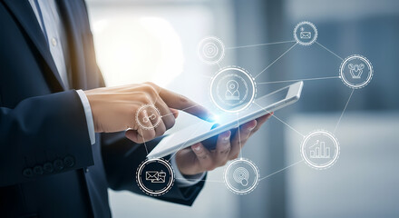 A business professional interacts with a digital tablet, showcasing modern technology and online connectivity in a contemporary office setting.