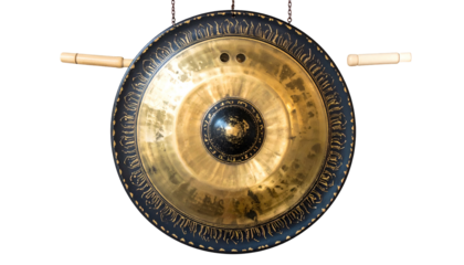 Gleaming gong hangs, wooden mallets poised for resonant sound