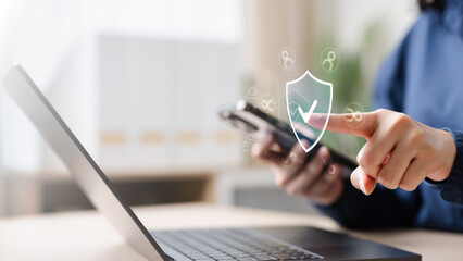 screen, share, prompt, permission, window, app, A person using a laptop and smartphone with a digital shield icon, representing secure screen sharing, data protection, and privacy permission control.