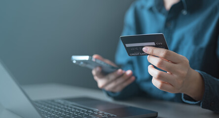 wallet, top up, funds, card, credit, balance, A person holding a credit card and smartphone while...