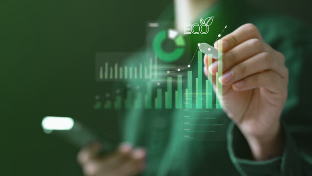 Person analyzing eco data and carbon footprint on digital interface, representing sustainability, green business, and climate responsibility for a better future.