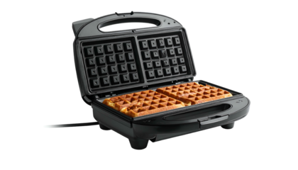 Open waffle maker with two golden brown waffles inside