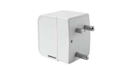 White power adapter with metal prongs isolated on a black backdrop