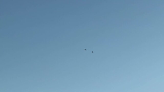 NATO fighter jet over a city near Mount Ararat and Yerevan, Two fighter jets in the sky perform a dangerous maneuver, pilots are preparing, dangerous turns. War. Middle East. 10.03.2025. High quality 