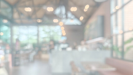 Horizontal, ultra-soft-focused image capturing the light-filled interior trendy café or lounge. Brightness and a deliberate light-leaky washed-out color palette