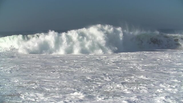 Huge waves breaking on shore during hurricane swell