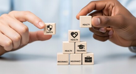 Hands building a foundation of health, safety, and career growth with symbolic blocks.