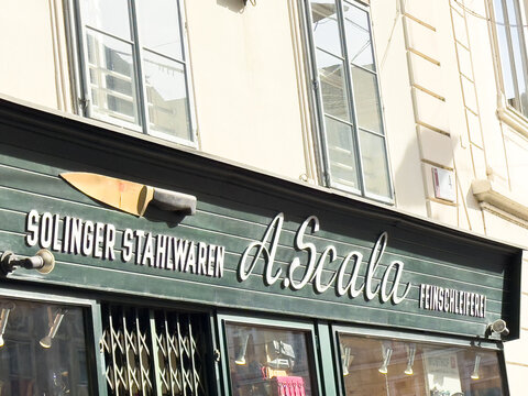 Graz, Austria - October 11, 2025: A. Scala shop front showcasing Solinger Stahlwaren with a distinctive knife sign, highlighting craftsmanship and quality in a vibrant urban setting