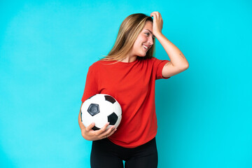 Young football player woman isolated on blue background has realized something and intending the solution