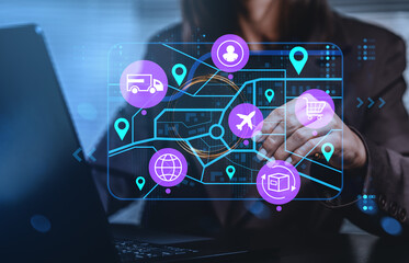 Logistics network digital interface with icons of delivery, shipment, and tracking over businesswoman using laptop in modern office environment.