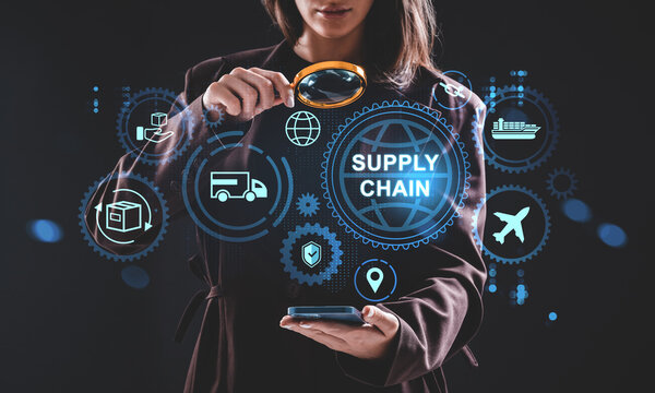 Woman analyzing digital supply chain hologram interface with magnifying glass on dark background, illustrating logistics technology concept.