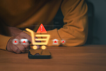 Person using smartphone with digital shopping cart and warning icons, symbolizing online shopping fraud, e-commerce scam, and payment risk. Concept of cybersecurity and consumer protection awareness.