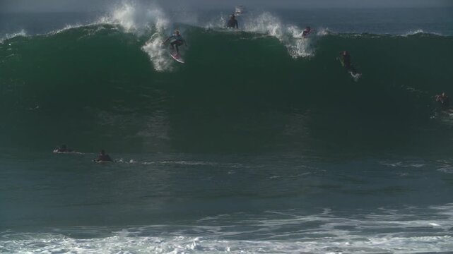 Surfer catching huge wave at The wedge, Newport Beach California