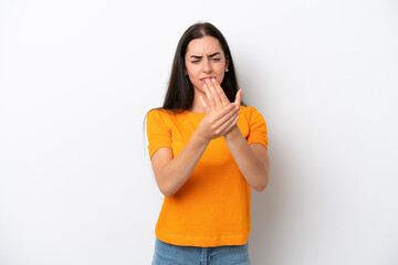Young caucasian woman isolated on white background suffering from pain in hands