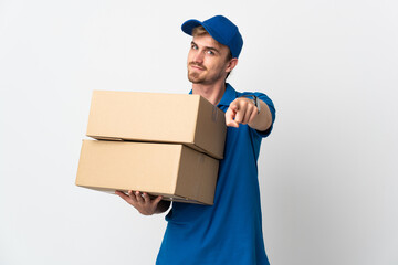Young delivery blonde man isolated on white background pointing front with happy expression