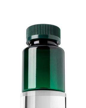 Green plastic bottle with ribbed screw cap, isolated on white background with clipping path