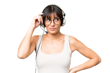 Telemarketer caucasian woman working with a headset over isolated background having doubts and with confuse face expression